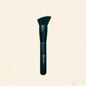 Sophiena angled contour makeup brush with dark green handle and dense black bristles on cream background
